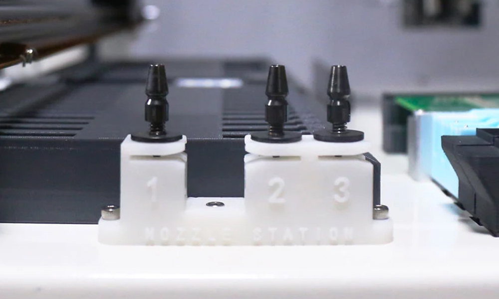 Nozzle changer base